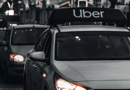 Uber pulls itself out of the red with first full-year profit since its 2019 IPO