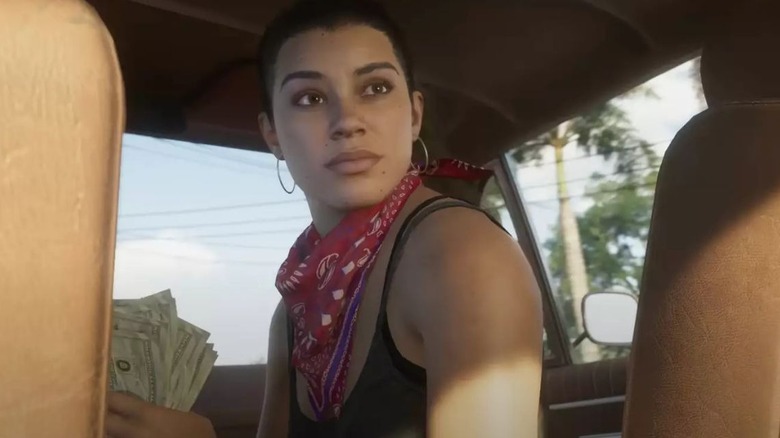 Une femme dans une voiture détenant de l'argent de Grand Theft Auto VI